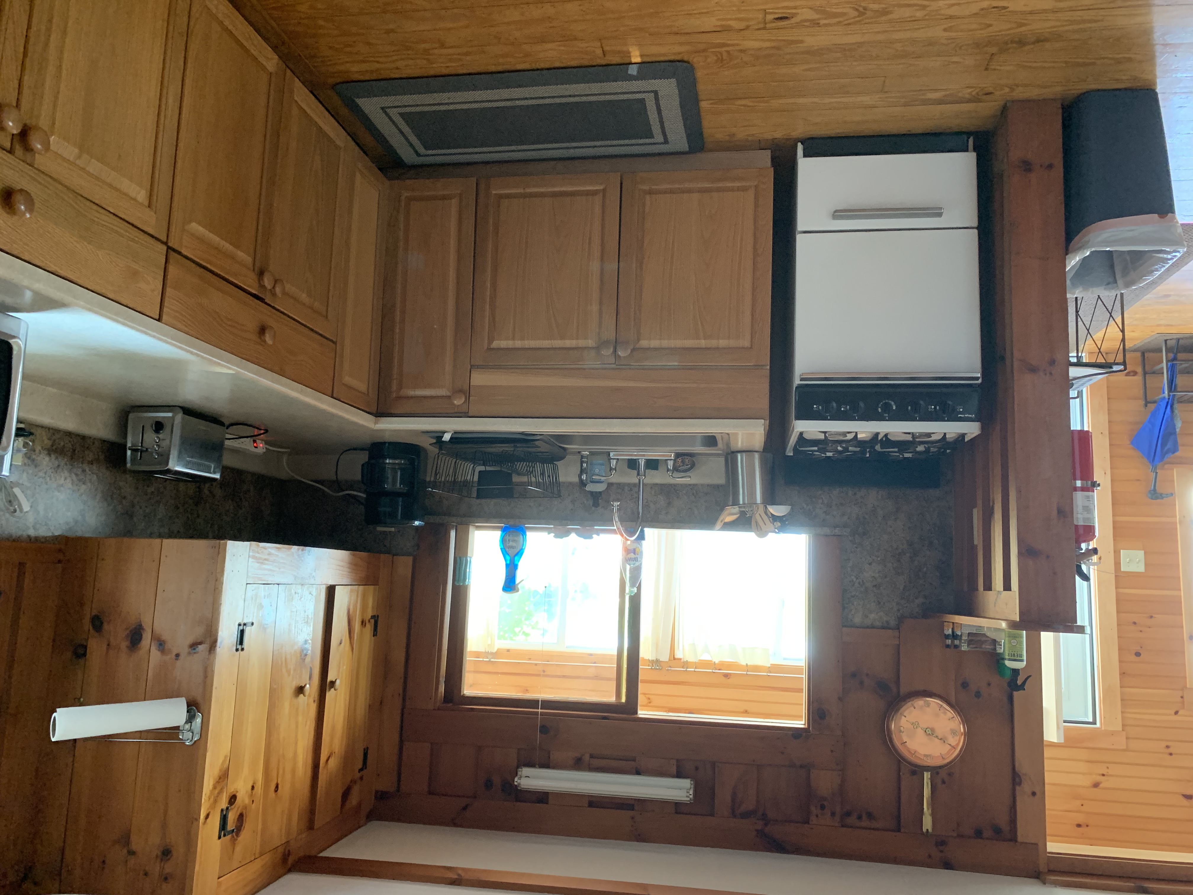 This casual setting also includes a living space decorated and furnished in country decor.