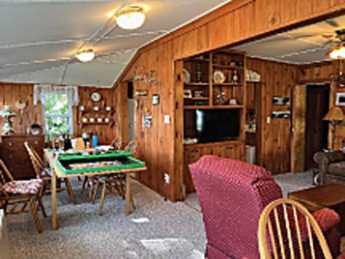 For your vacation at Anglemore enjoy the open dining/living area surrounded with country charm.