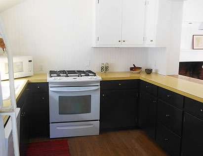 A modern kitchen with newer stainless stell appliances allows for the comforts of home.