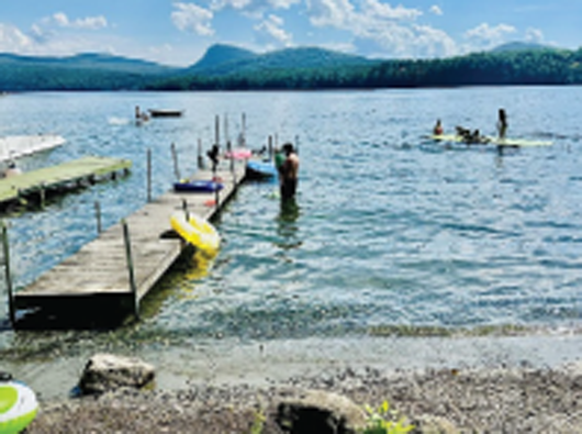 Enjoy a lakefront vacation in this fabulous home complete with beach and dock where you can launch your boat.