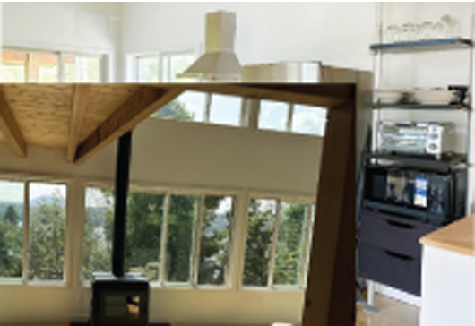 Views abound in this pristine contemporary vacation home.  Enjoy the stove on chilly nights.